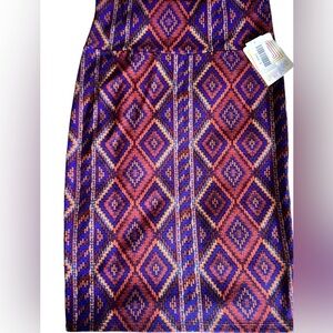 Lularoe blue small Cassie pencil skirt. NWT .‎ Aztec print red, orange, yellow.